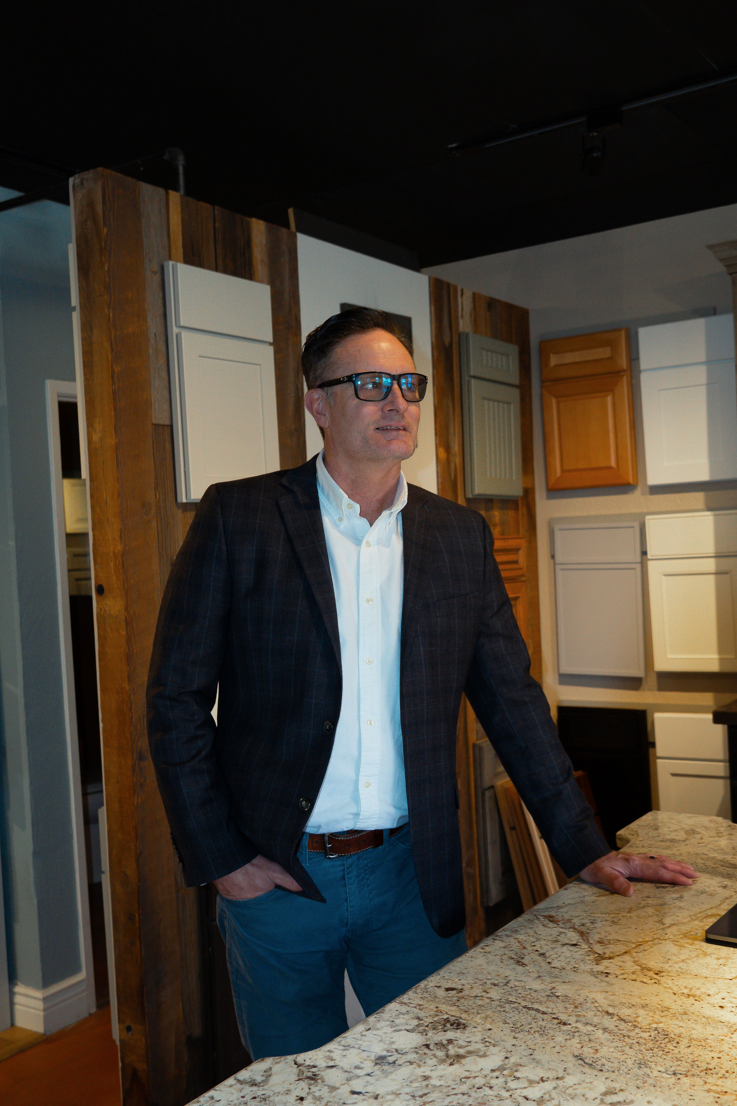 Ken Brown at the cabinet sample display wall