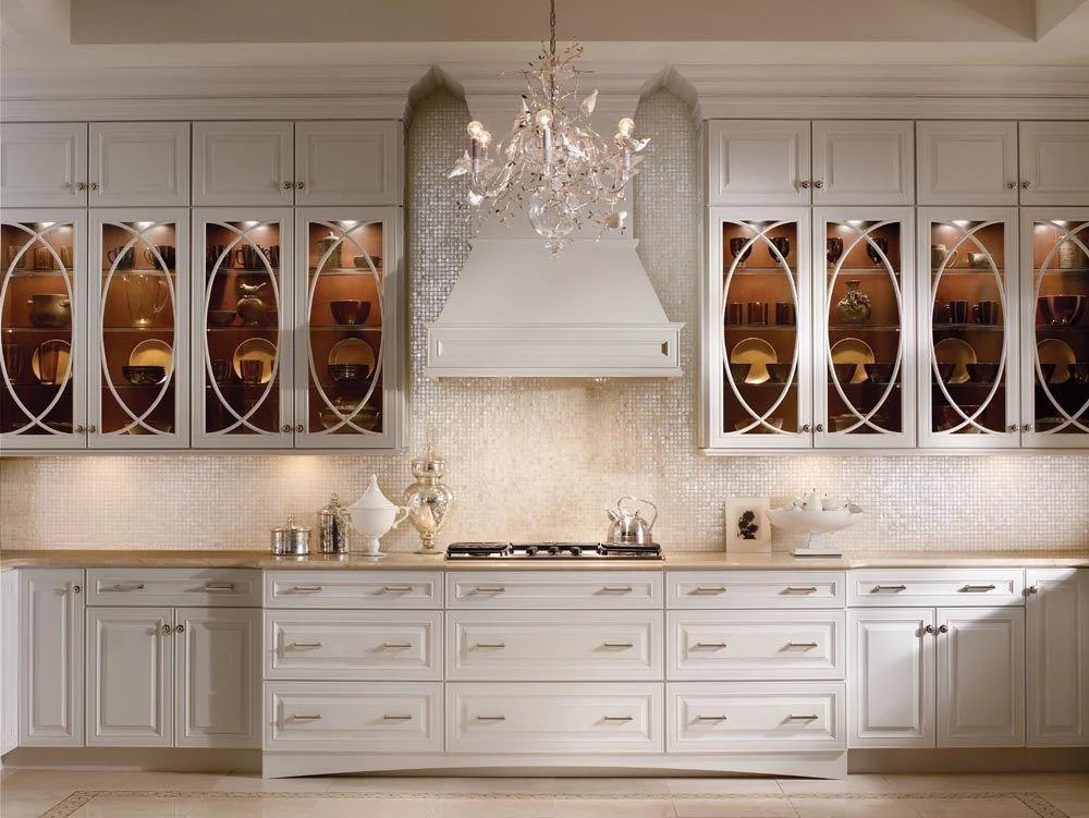 Luxury white kitchen with oval glass cabinets
