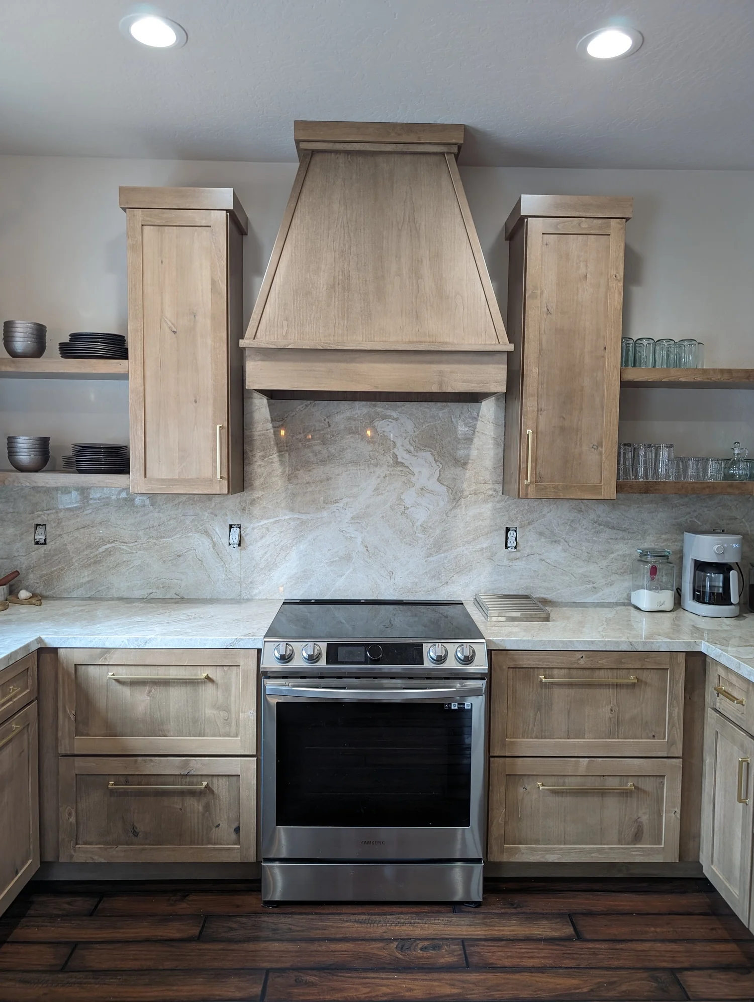 Natural wood kitchen with range hood