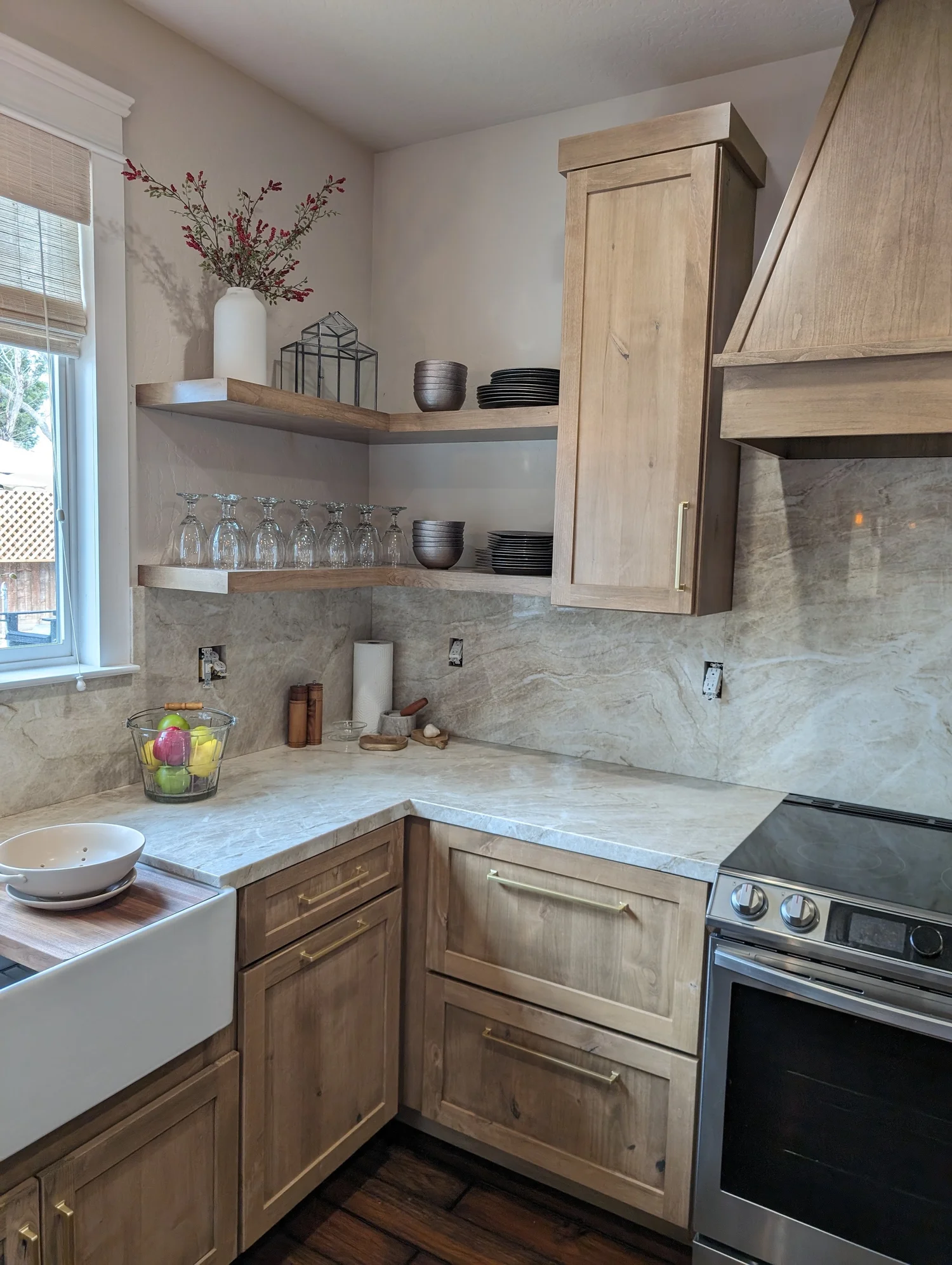 Natural wood kitchen corner with open shelving